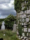 Chapel Wall and Gravestones with metal cross (153497 bytes)